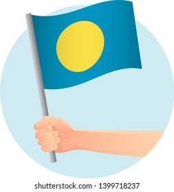 Palau flag in hand. Patriotic background. National flag of Palau vector illustration
