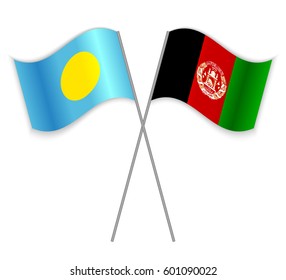 Palauan and Afghan crossed flags. Palau combined with Afghanistan isolated on white. Language learning, international business or travel concept.