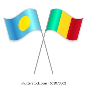 Palauan and Guinean crossed flags. Palau combined with Guinea isolated on white. Language learning, international business or travel concept.