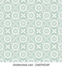 Pale green ornament seamless vector pattern. Symmetrical flower backdrop. Geometric floral background. Ethnic graphic illustration. Wallpaper, fabric, textile, print, wrapping paper or package design