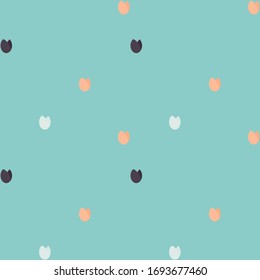 Pale peach pink, white and chocolate colored brown flowers of tulip on light blue background. Seamless pattern. 
