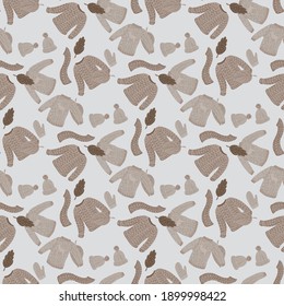 Pale seamless pattern with pastel brown sweaters, scarf, mittens and hats. Grey background. Random print. Stock illustration. Vector design for textile, fabric, giftwrap, wallpapers.