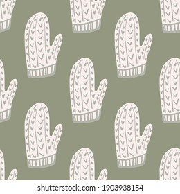 Pale tones seamless pattern with white winter ornament mittens shapes. Grey background. Xmas backdrop. Graphic design for wrapping paper and fabric textures. Vector Illustration.