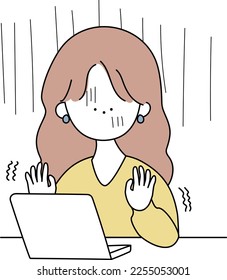 A pale and trembling woman using a computer White