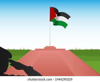 The Palestinian flag flies above the pole in the shadow of a soldier saluting the flag