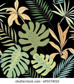 Palm leaves on a black background. Tropical print. Seamless pattern.