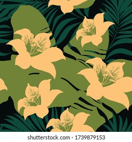 Palm leaves on a tropical background. Tropical seamless background pattern. Graphic design with amazing palm trees suitable for fabrics, packaging, covers