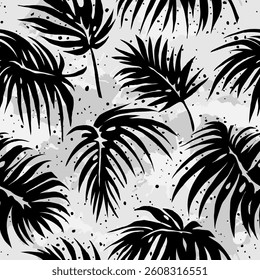 Palm leaves. Pattern of black palm leaves on a gray background in grunge style. Drawn with brush strokes, splashes, blots.