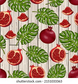 Hojas de palma y granadas.Patrón vectorial con granadas rojas y hojas de palma sobre un fondo de madera.