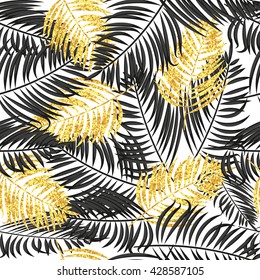Palm leaves seamless pattern in black and gold colors. Tropical vector background with sparkling palm leaves. 