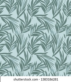 Palm leaves seamless pattern in green colors
