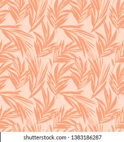 Palm leaves seamless pattern in trendy 2020 coral colors