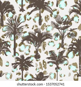 Palm tree seamless pattern with abstract animal skin texture. Silhouettes of drawn tropical plants on leopard background. Flat trendy exotic background with banana and coconut palm trees. 