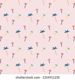 Palm trees. Seamless pattern. Tropical pattern. Eps10 vector. Vector illustration on a pink background.