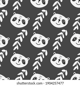 Panda head pattern with a sprig of leaves on a black background