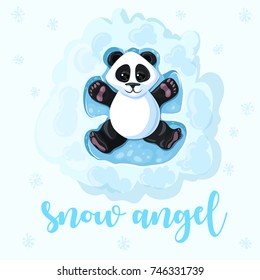 Panda is lying in the snow playing. Creating an Angel in the Snow