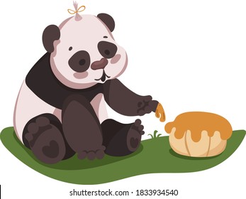 
Panda sits on the grass and tastes a pie with her paw