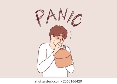 Panic attack in man breathing into paper bag to overcome fear and restore calm. Problem of panic attack for guy who needs sedative and antidepressants to relieve stress and depression