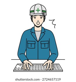 Trabajador masculino del pánico con el casco que escribe en el teclado de la computadora
