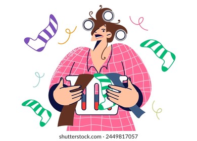 Panicking woman housewife preparing to do laundry, holding basket with dirty socks and underwear. Frightened homemaker girl in curlers, wants to use laundry services or city laundromat
