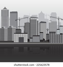 panorama of city building with cranes and reflection