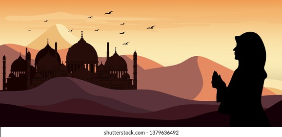 Panorama landscape Silhouette of one women praying in the desert background during the month of ramadan, Muslim woman praying during sunset with mosque background, Concept of the Islamic religion