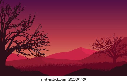 Panorama of the mountains with a fantastic dry tree silhouette from the countryside at twilight in the afternoon. Vector illustration of a city