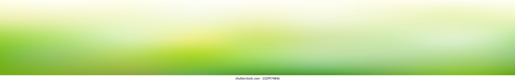 Panoramic abstract green blurred gradient background.  Horizontal view for a glass panels - skinali. Trendy modern nature backdrop. Ecology concept for your graphic design. 