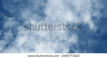 A panoramic sky filled with billowing clouds rolling gently, creating an ever-changing work of art

