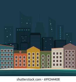 Panoramic View Of Night City With Skylines, Sea And Colorful Houses.