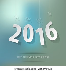 paper 2016 digits on blue bokeh background 