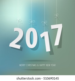 paper 2017 digits on blue bokeh background