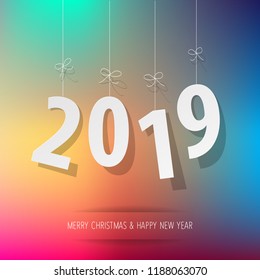 Paper 2019 digits on a rainbow bokeh background.