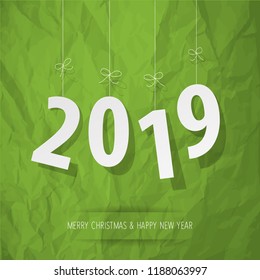 Paper 2019 digits white on a crumpled paper green background.