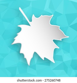Paper 3d maple leaf over blue abstract geometric triangular background.
