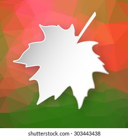 Paper 3d maple leaf over abstract geometric triangular background.