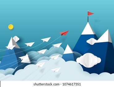 Paper airplanes flying above mountains and blue sky.Paper art style of business teamwork creative concept idea.