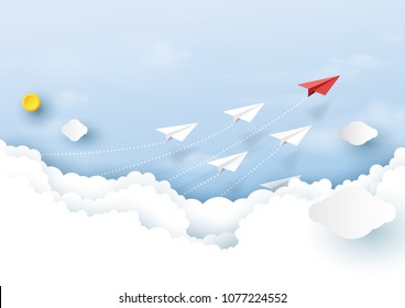 Paper airplanes flying on clouds and blue sky.Paper art style of business teamwork creative concept idea.
