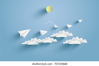 paper airplanes flying over clouds. design with art paper and craft.