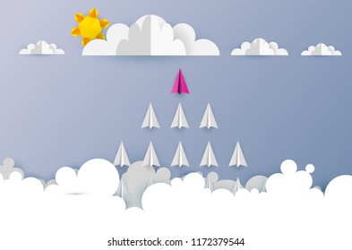 Paper airplanes in form of arrow shape flying from clouds on blue sky.Paper art style of business teamwork creative concept idea.Vector illustration