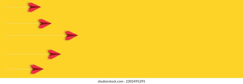 Paper airplanes on yellow background.
the plane in front leads the others. Overcoming obstacles idea concept.