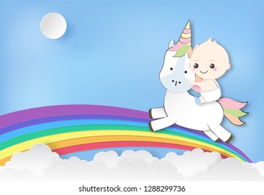 Paper art of Baby boy riding with unicorn and rainbow on blue sky paper cut style illustration