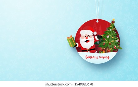 Paper art of Christmas circle tag banner and hanging rope on blue snowflake background, Merry Christmas and Happy New Year