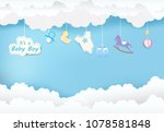 Paper art of cloud with toy shower on blue sky paper cut style, baby boy card illustration