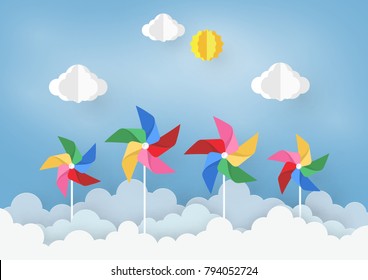 Paper Art  Design with Cloud and pinwheel  on light Blue background . the Concept is freedom or positive thinking ,vector design element illustration