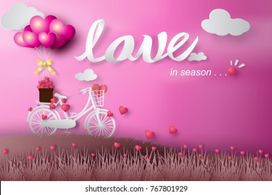 Paper art of happy valentine day balloon flying over bicycle and grass with heart float on the sky.