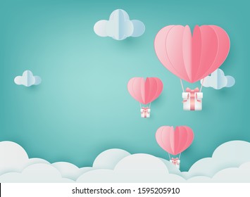 Paper Art Heart shaped balloons and gift boxes floating above the clouds in the sky.Love of valentine day.