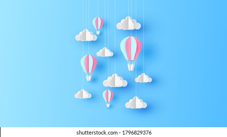 Paper art of Hot air balloon and cloud hanging down from the sky background. Hot air balloon with cloud. paper cut and craft style. vector, illustration.