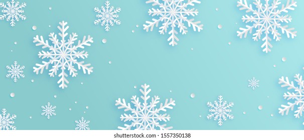 Paper art made snowflakes on blue background. Digital craft paper cut style.