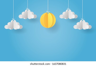 Paper art of origami mobile paper sun and cloud on blue sky backgrond